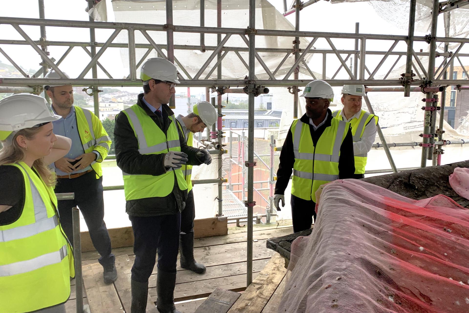 R&R team meeting Palace Theatre team on building scaffolding.